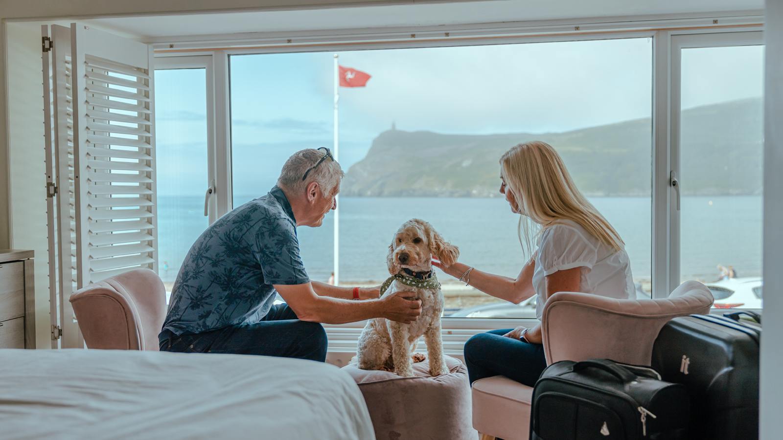 Couple and their dog at Seaside Cottages